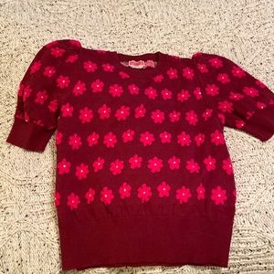 Short puffed sleeve cotton sweater. Worn once. Sits at the hip.